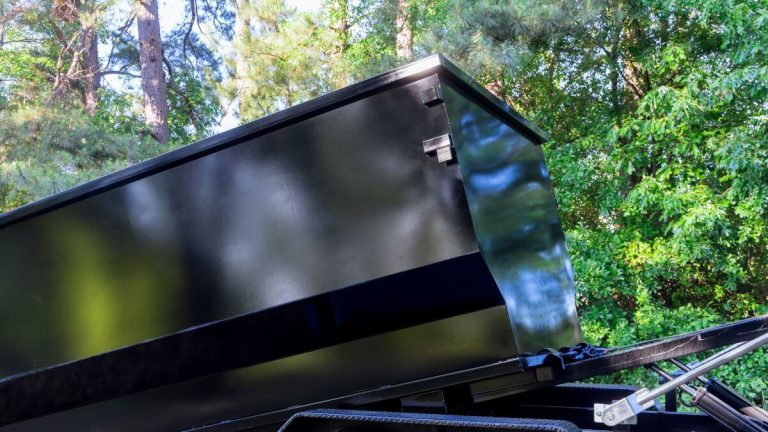 Loading Doors, Trim, and Baseboards Into a Dumpster